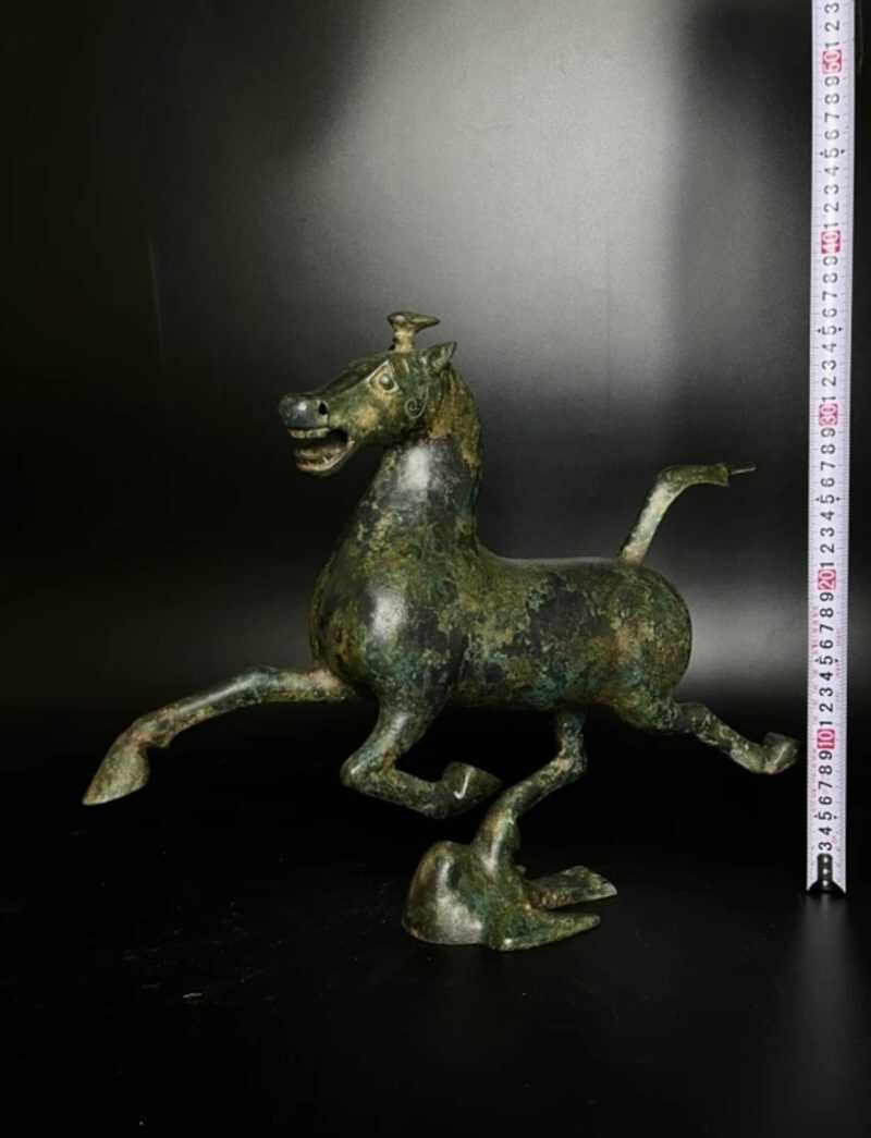 Horse steps on flying swallow, copper galloping horse