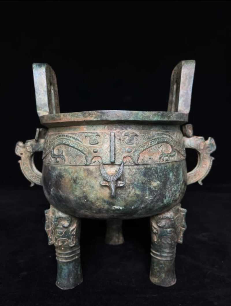 Antique bronze tripod