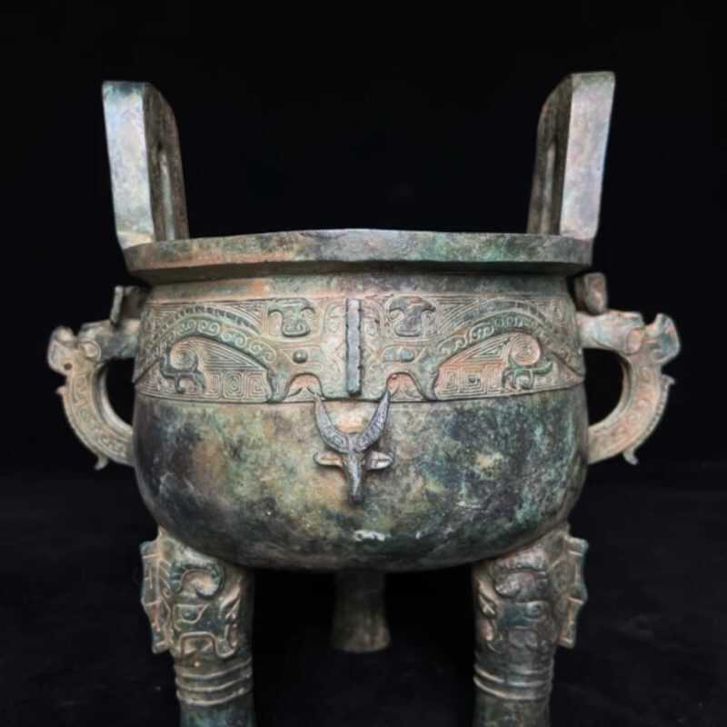 Antique bronze tripod