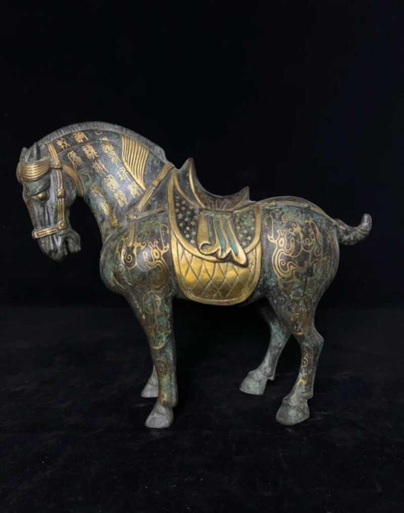 Antique bronze horse with gold inlay
